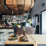 A contemporary restaurant showcasing fresh gourmet dishes on a stylish wooden table.